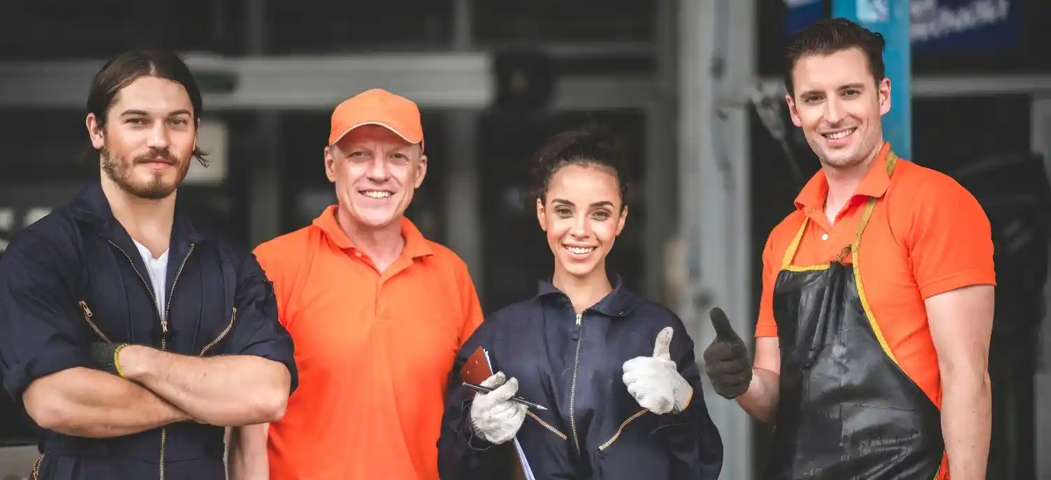 Four certified appliance repair technicians in uniform ready to serve Lexington KY homeowners
