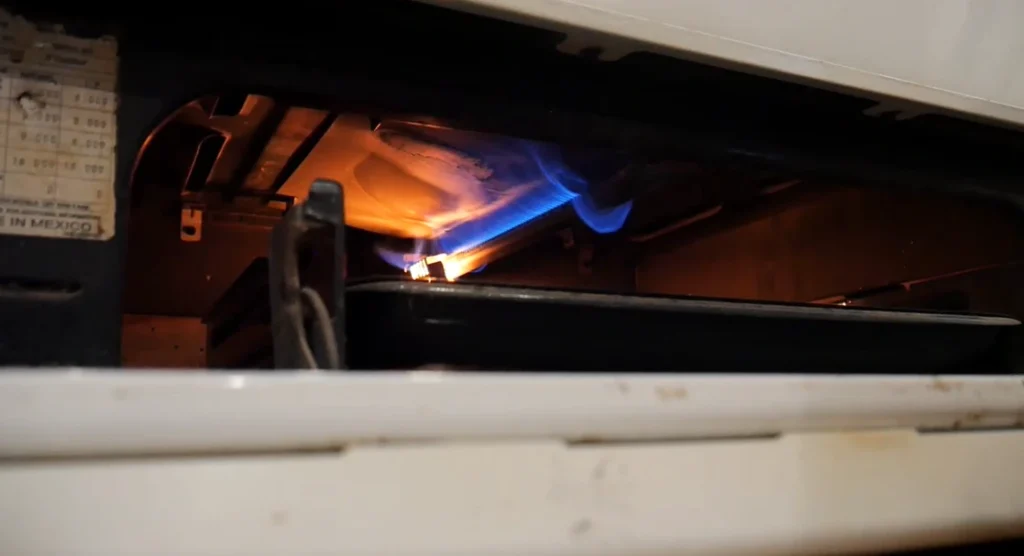 Gas oven igniter burning with blue flame inside a Lexington KY home oven