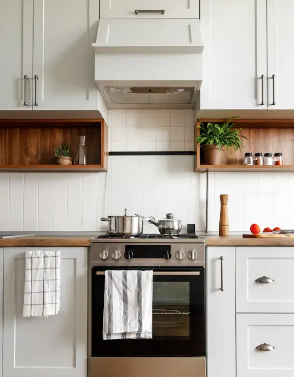 White kitchen with a stainless steel gas stove in a Lexington KY home